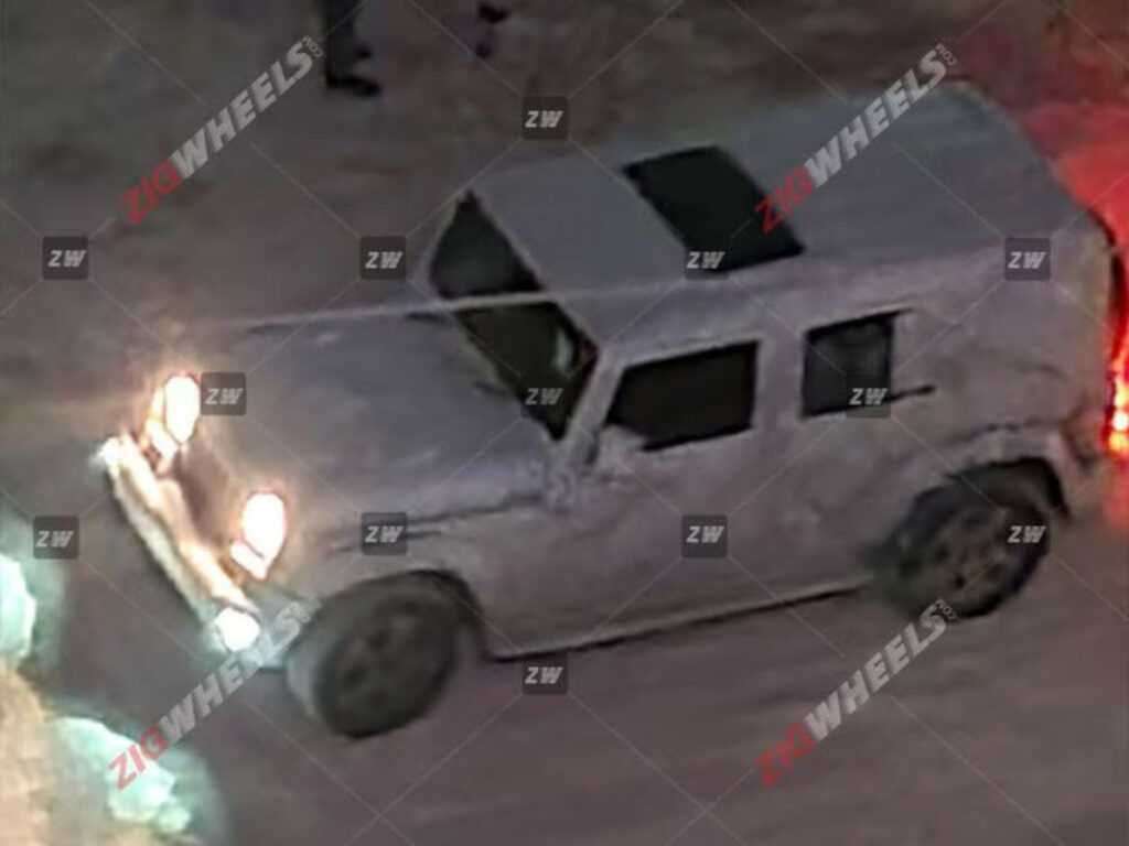 The spy shots of the 5-door Mahindra Thar suggest several new features and updates compared to the 3-door version. Here's a summary. Features Sunroof: The 5-door Thar will come equipped with a single-pane sunroof. It is positioned between the front and second rows, indicating that the vehicle may have a full metal hard top to accommodate this feature. LED Lighting: The presence of LED fog lamps on the test mule suggests that the production version of the 5-door Thar will have a complete LED lighting setup. Cabin and Features: Mahindra might offer an all-black cabin for the 5-door Thar, as seen in one of the test mules. The SUV will feature an 8-inch touchscreen infotainment system with connected car technology, auto climate control, and cruise control. Safety features may include up to six airbags, electronic stability control (ESC), and a rear parking camera. Engine Engine Options: The 5-door Thar will likely have the same petrol and diesel engine options as the 3-door version. These engines are expected to be in higher states of tune. The 3-door Thar currently offers a 2.0-litre turbo-petrol engine with 150PS and a 2.2-litre diesel engine with 130PS. The 5-door Thar may also come with 2WD variants and will be available with both manual and automatic gearbox options. Launch and Price: Mahindra has confirmed that the 5-door Thar will be launched in 2024. The expected starting price for the SUV is around Rs 15 lakh (ex-showroom). Here are some additional details about each of the pros and cons of the current Mahindra Thar Pros: Rugged and capable off-roader: The Mahindra Thar is one of the most capable off-roaders in its class. It has a 4x4 drivetrain with high and low-range gears and a locking differential. It also has a ground clearance of 226 mm and approach and departure angles of 41 and 37 degrees, respectively. This makes it perfect for tackling any terrain, from the roughest trails to the most challenging off-road courses. Powerful engines: The Mahindra Thar has two powerful engines: a 2.0-litre turbo-petrol engine and a 2.2-litre diesel engine. The petrol engine produces 150 PS and 320 Nm of torque, while the diesel engine produces 130 PS and 320 Nm of torque. Both engines are mated to a 6-speed manual transmission, with an automatic transmission available. Spacious and comfortable interior: The Mahindra Thar has a spacious and comfortable interior. The front seats are supportive and comfortable, even on long journeys. The rear seats are also spacious and can comfortably accommodate two adults. The cabin is also well-appointed, with features such as a touchscreen infotainment system, automatic climate control, and cruise control. Good value for money: The Mahindra Thar is a good value for money. It offers a lot of features and capabilities for its price. It is also backed by a strong warranty. Wide range of variants to choose from: The Mahindra Thar is available in a wide range of variants. This includes both 2-door and 4-door variants and a soft-top and hard-top. There are also a variety of engine and transmission options to choose from. This makes it easy to find the perfect Thar for your needs. Cons: Poor fuel economy: The Mahindra Thar has poor fuel economy. The petrol engine returns an average of 10-12 km in the city and 14-16 km on the highway. The diesel engine is slightly more fuel-efficient, producing an average of 12-14 km in the city and 16-18 km on the highway. NVH levels can be high on the highway: The Mahindra Thar can be noisy. The engine and road noise can be intrusive, making talking or listening to music difficult. Some safety features need to be added on lower variants: Some safety features, such as airbags and ABS, are missing on lower variants of the Mahindra Thar. This is a concern, as these features can be critical in an accident. Not as refined as some of its rivals: The Mahindra Thar is less advanced than some competitors. The ride can be bumpy, and the handling can be agricultural. This is not a significant concern for off-road enthusiasts, but it may be a turn-off for those looking for a more comfortable and refined SUV. Overall, the Mahindra Thar is an excellent choice for buyers looking for a capable and stylish off-roader. However, it is essential to consider its fuel economy, NVH levels, and lack of some safety features before making a decision. Conclusion The 5-door Thar will offer a more extensive alternative to the Maruti Jimny and will likely compete with the upcoming 5-door Force Gurkha. Source: Zigwheels
