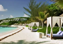 Mandarin Oriental Kanai Riviera Maya’s Next New Luxury Hotspot DALL·E-2024-09-26-08.29.21-A-luxurious-beachfront-scene-depicting-the-essence-of-the-Mandarin-Orientals-exclusive-journeys-along-the-Maya-coastline.-The-image-showcases-a-prist.webp